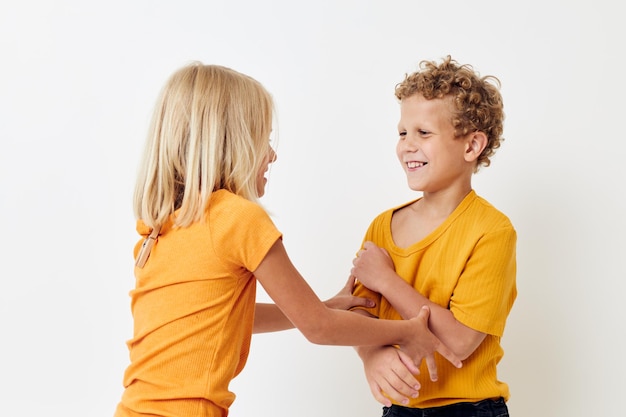 Photo sibling playing against white background