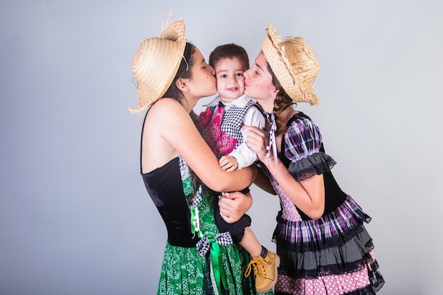 Siblings family friends brazilians with clothes from festa junina arraial festa de sao joao Horizontal portrait