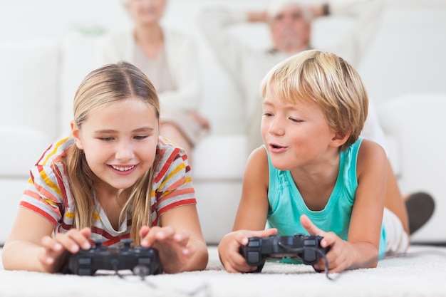 Photo siblings playing video games