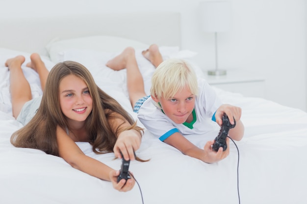 Siblings playing video games 