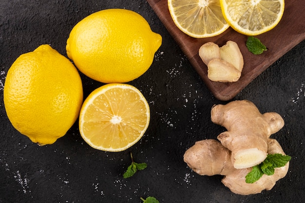 Sicilian lemon, ginger and mint on a slate stone.