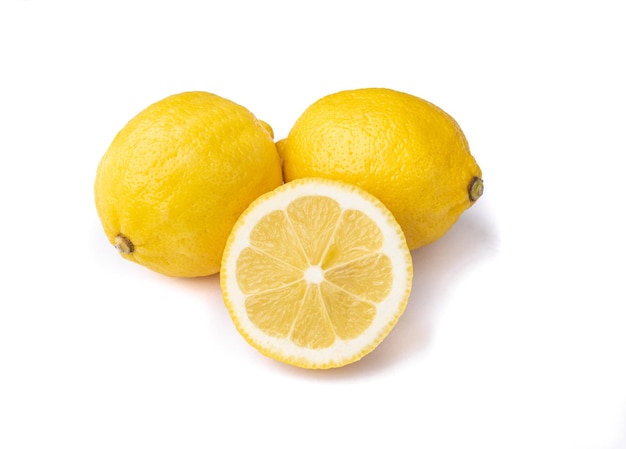 Sicilian lemons and half fruit isolated over white background