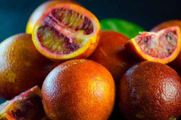 Sicilian oranges close-up on a black background