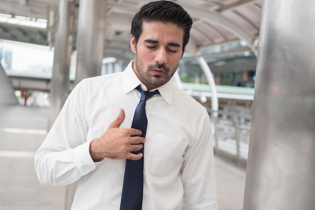 Photo sick asian man with acid reflux or gerd; portrait of unhealthy, sick asian indian man with reflux, inflammation