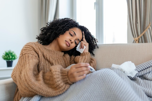 Sick day at home young woman has runny and common cold cough\
closeup of beautiful young woman caught cold or flu illness\
portrait of unhealthy woman with coronavirus covid19 symptoms