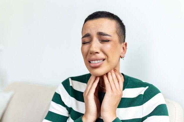 Sick day at home young woman has sore throat and common cold\
cough closeup of beautiful young woman caught cold or flu illness\
portrait of unhealthy girl with coronavirus covid19 symptoms