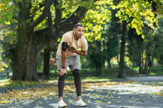 Sick man has severe heart pain after jogging african american man holding hand to chest fast heart