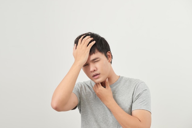 Sick man has a sore throat isolated on a white background