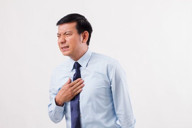 Sick man suffering from acid reflux, gerd, heartburn, indigestion