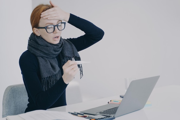 Sick manager at online conference Unwell girl is shocked with her temperature and fever