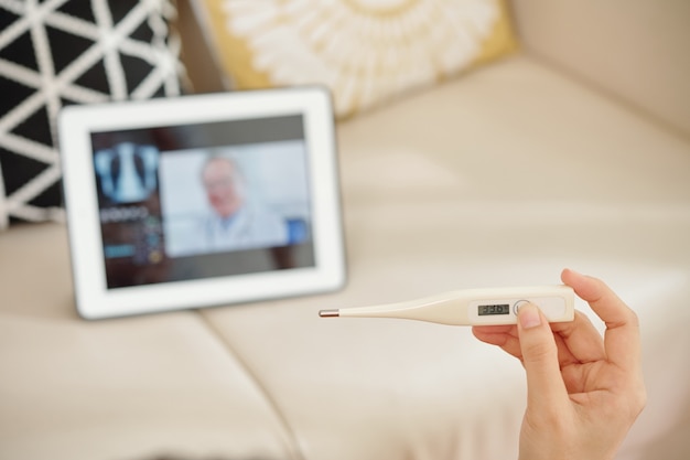 Sick woman consulting with doctor