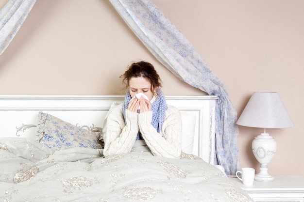 Sick woman lie down on her bed