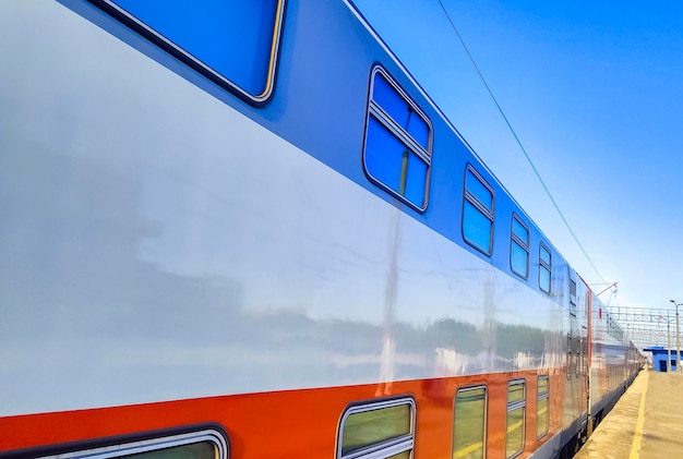 Side of a doubledecker train leaving a station