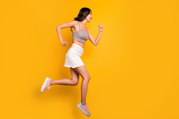 Side profile full length body size photo of cheerful positive cute pretty nice girlfriend running towards jumping sales isolated vivid color background