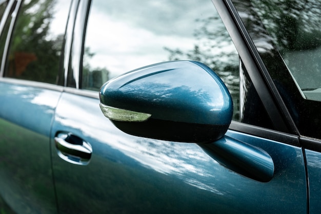 Side rear-view mirror on a modern car.