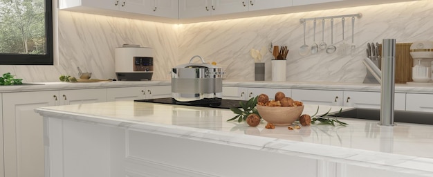 Side view of a 3D white marble island in luxury kitchen and cracked walnuts in a wooden dish,