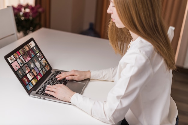 Side view adult working on laptop