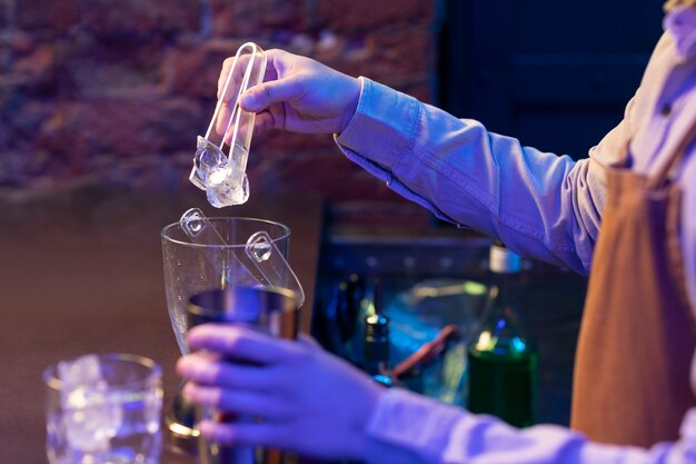 Side view bartender preparing drink