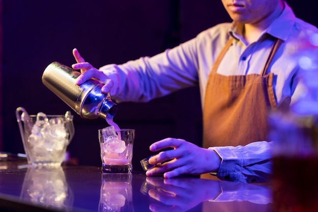 Side view bartender preparing drink