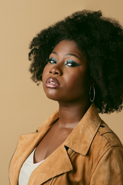 Side view beautiful black woman posing in studio