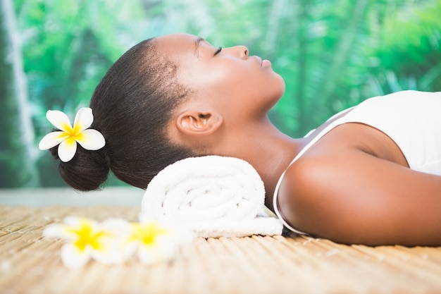 Side view of a beautiful woman on massage table