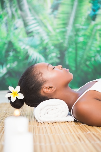 Side view of a beautiful woman on massage table