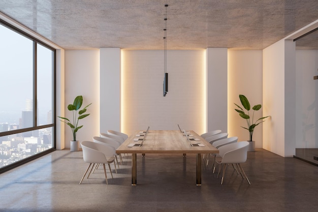 Side view on big wooden conference table with modern laptops surrounded by white chairs on concrete glossy floor in spacious board room with city view from panoramic window 3D rendering