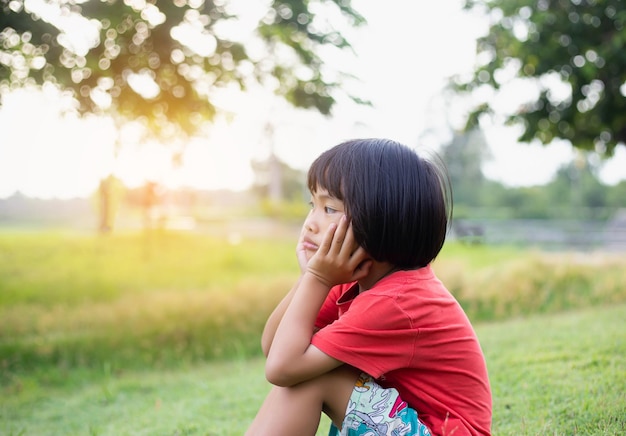Side view of boy on field