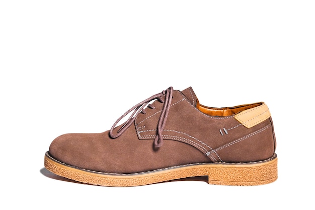 Photo side view of brown shoe with laces isolated on a white background