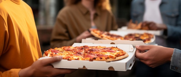 A side view of buddies relishing pizza during an alfresco gathering