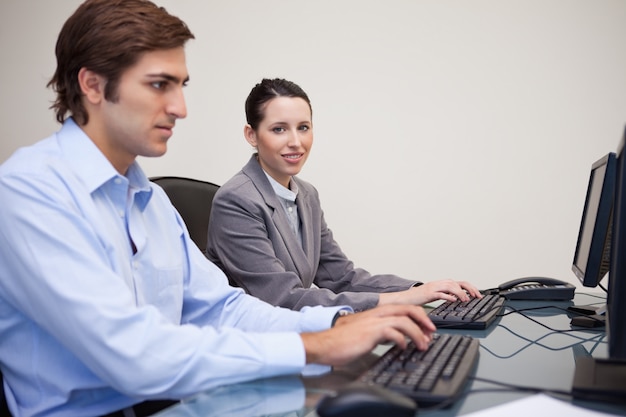 Side view of business team working in their office