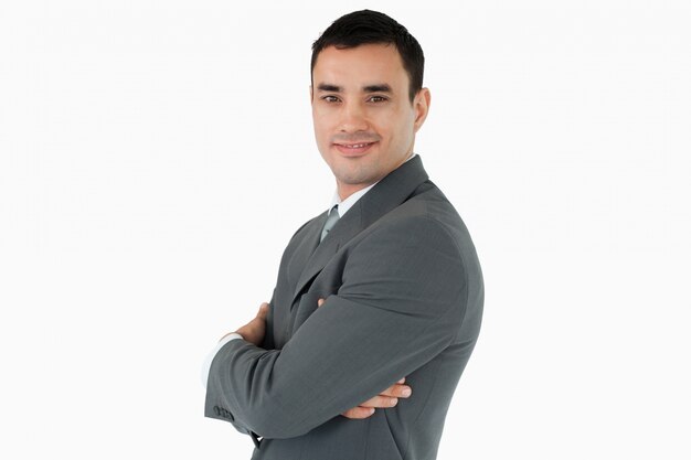 Side view of businessman with arms folded