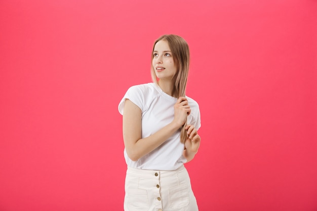 Side view of a casual young woman looking away from the camera