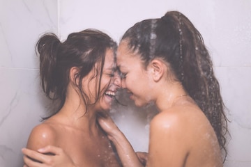 lesbian in the bathroom flat chest wet  