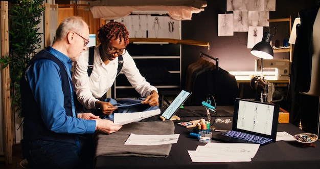 Side view of colleagues working at office