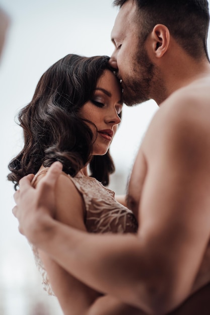 side view of couple embracing at home