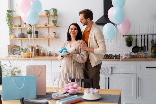 Photo side view couple at gender reveal party