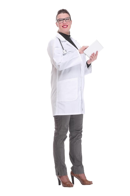 Side view of a doctor wearing glasses using a tablet computer