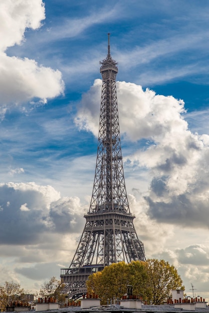 Side view of the eiffel tower with the seine river beside it