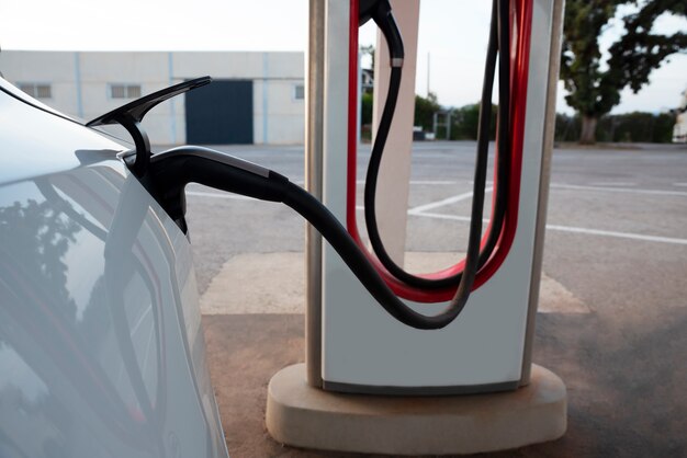 Side view electric car charging  outside