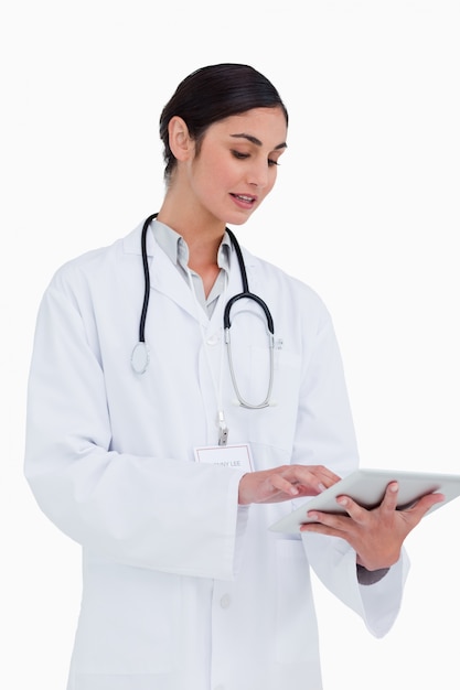 Side view of female doctor with tablet computer