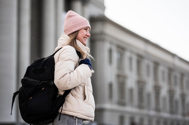 Side view female student with backpack