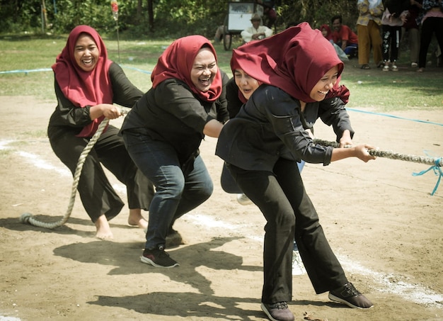 Side view of friends playing in park