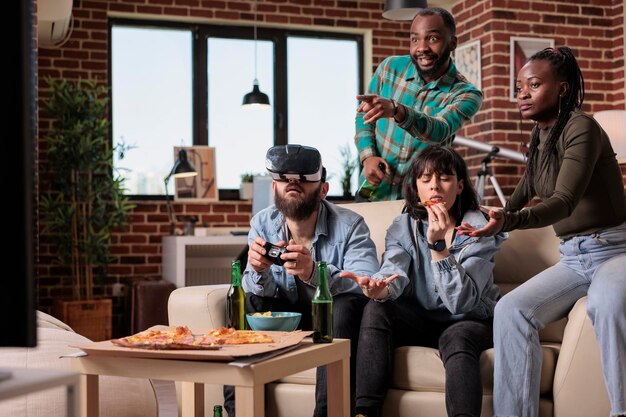 Side view of friends using mobile phone while sitting on table