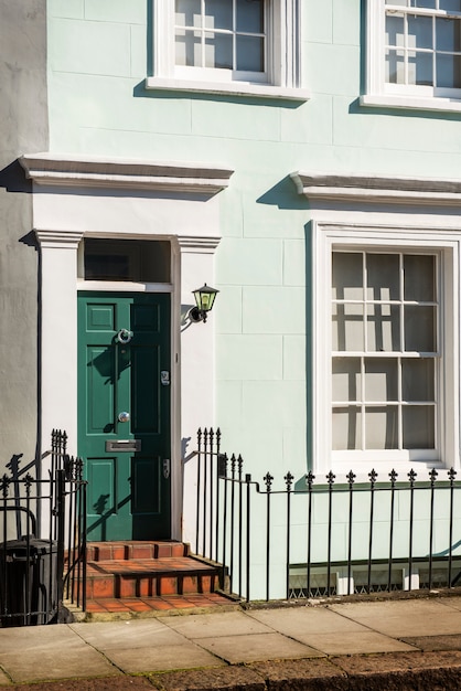 Side view of front door with gray and green wall