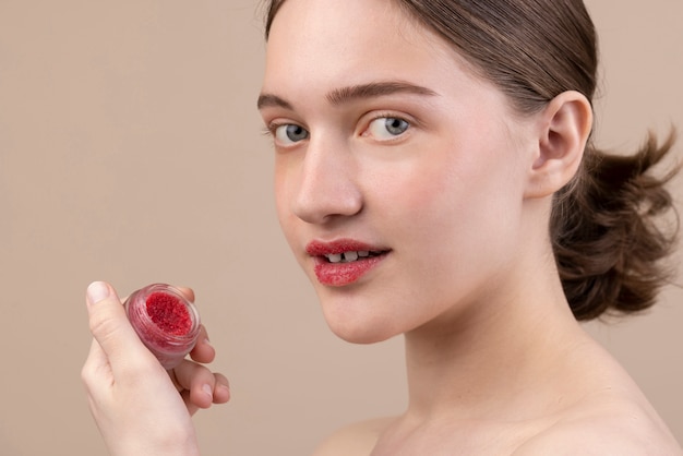 Side view girl holding small container