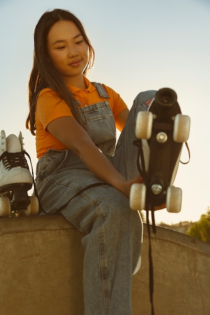 Side view girl with roller skates