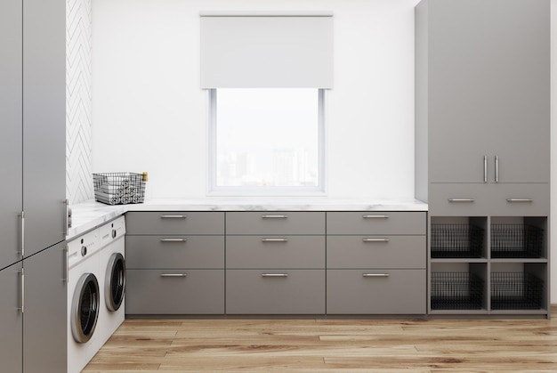 Side view of a gray washroom corner with black wooden walls, two washing machines, and gray closets and countertops. 3d rendering mock up