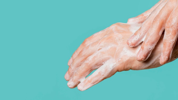 side view of hand washing with copy space