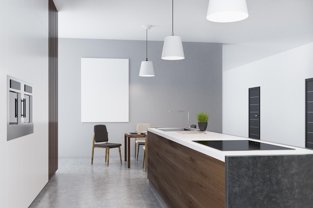 Side view of a kitchen interior in a studio flat with a black counter top, a sink, two stoves, a square table and chairs. Vertical poster on a gray wall. 3d rendering, mock up